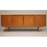 A DALESCRAFT TEAK SIDEBOARD,1960's, the fascia with a pair of recessed doors enclosing four small