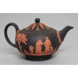 A WEDGWOOD ROSSO ANTICO TEAPOT AND COVER, 1988, of squat globular form, with classical figure