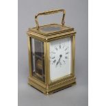 A BRASS CASED CARRIAGE CLOCK, the twin barrel movement with platform escapement striking on a