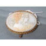 A VICTORIAN SHELL CAMEO BROOCH, the two tone shell carved with the bust portraits of two young