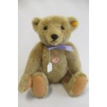 A large Steiff 1906 replica teddy bear, with felt pads, chest label, ear button and tag, 53cm