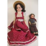 Two antique dolls, comprising an Armand Marseille bisque shoulder head, with blue glass sleeping