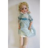 A Schoenau & Hoffmeister bisque socket head doll, with blue glass sleeping eyes, open mouth,