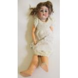 An Alt, Beck & Gottschalck bisque socket head doll, with blue glass sleeping eyes, open mouth,