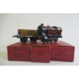 Hornby clockwork 101 L.M.S. tank locomotive and three No 1 good trucks, some items boxed, F-G (