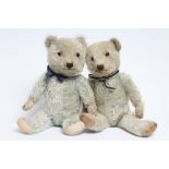 A rare pair of Chiltern blue teddy bears, both with blue plush, amber eyes, sewn noses and cloth