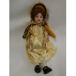 A Japanese Nippon bisque socket head character doll, with blue glass sleeping eyes, open mouth,