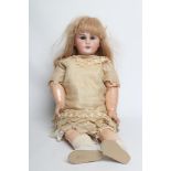 A Tete Jumeau bisque socket head doll, with blue glass sleeping eyes, open mouth, moulded teeth,