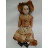 An SFBJ bisque socket head doll, with brown glass sleeping eyes, open mouth, 6 top teeth, pierced