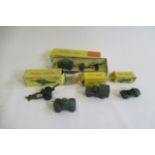 Dinky army vehicles comprising 674 Austin Champ, 641 Cargo Truck, 697 Field Gun Set, 693 Howitzer