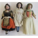 Three bisque shoulder head doll's house dolls, with painted features, bisque arms and legs,