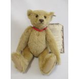 A large Steiff 1907 replica teddy bear, with felt pads, button eyes, ear button and label, with