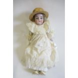 A possible Kestner bisque shoulder head doll, with blue glass sleeping eyes, open mouth, teeth,