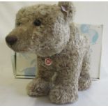 A boxed Steiff Grizzly bear, standing on four legs, 56cm long (Est. plus 21% premium inc. VAT)