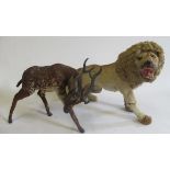 Two real hair plush animals, comprising a deer and a lion, both wrapped in hide and modelled