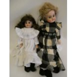 Two Armand Marseille bisque shoulder head dolls, comprising one 3200 with brown glass fixed eyes,