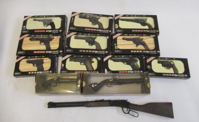 Ten Armodelli miniature pistols, boxed, a miniature Winchester rifle and two Armodelli antique model