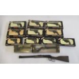 Ten Armodelli miniature pistols, boxed, a miniature Winchester rifle and two Armodelli antique model