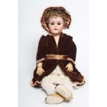 A Simon & Halbig bisque socket head doll, with brown glass sleeping eyes, open mouth, teeth, pierced