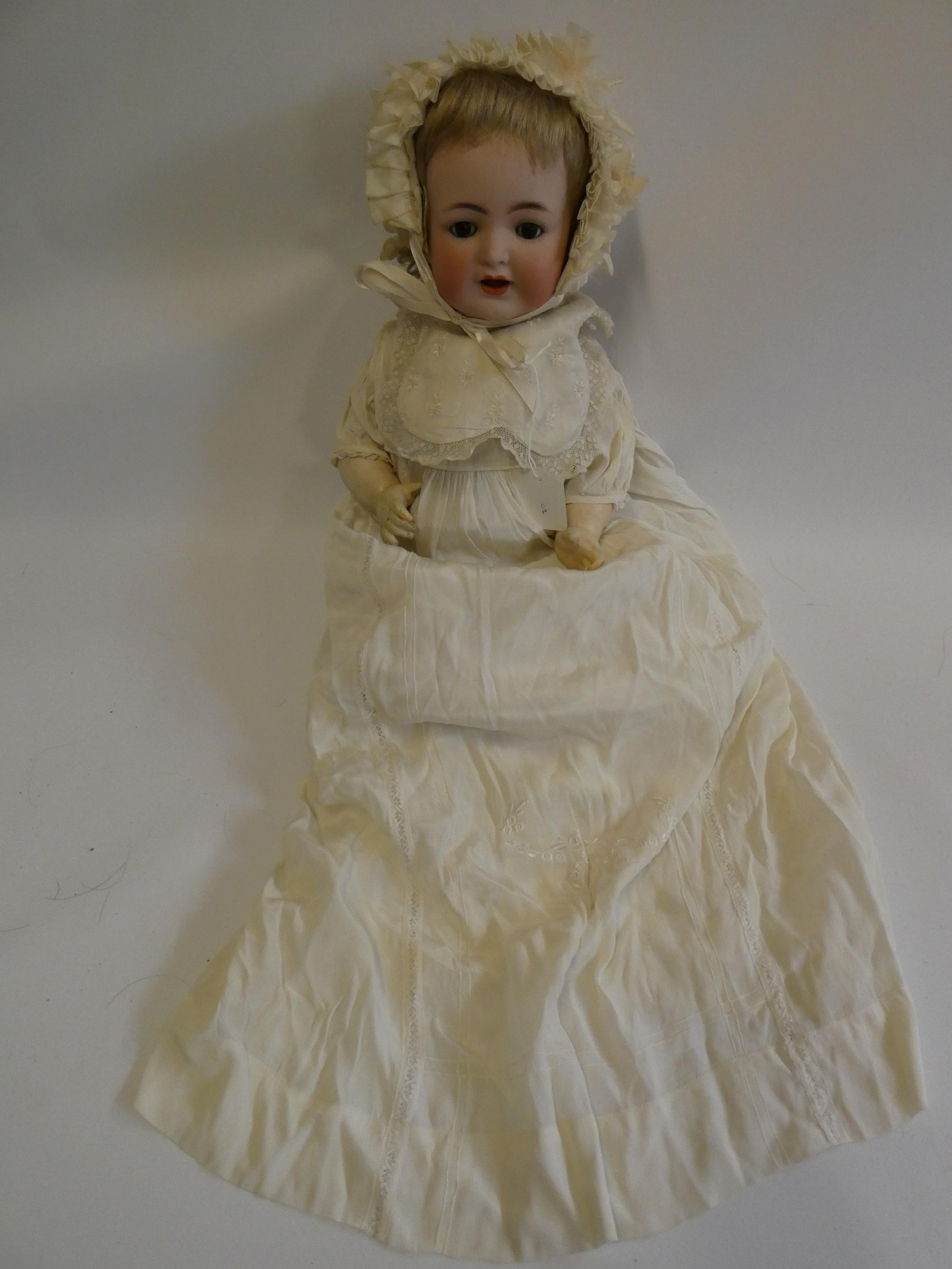 A Kammer & Reinhardt bisque socket head character doll, with brown glass sleeping eyes, open
