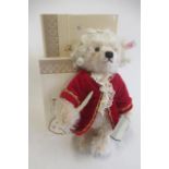 A boxed Mozart teddy bear, dressed as the composer, with certificate, 28cm (Est. plus 21% premium