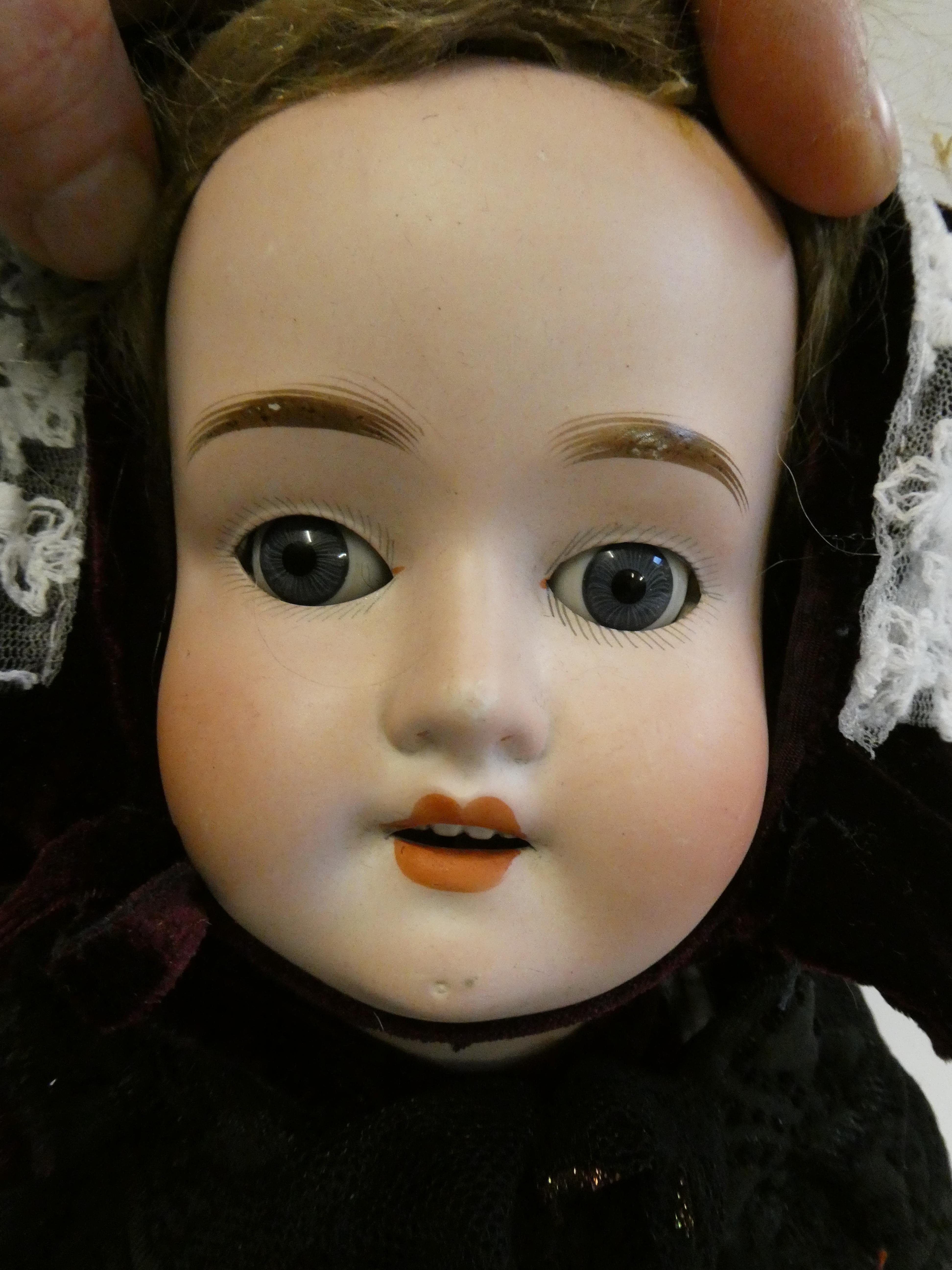 A Schoenau & Hoffmeister bisque socket head doll, with blue glass sleeping eyes, open mouth, - Bild 2 aus 3