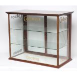 A fine quality Cadbury's Chocolate Shop display cabinet, wood frame with glass infill sliding door