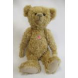 A large Steiff replica bear, 2004 edition, with button eyes, felt pads, chest label, grey metal