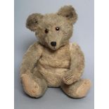 A pre-war German Joppi type musical teddy bear, with bellows movement, pink glass eyes, yellow