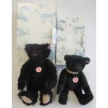 Two boxed Steiff black bears, one 35cm the other 32cm, both with collars (Est. plus 21% premium inc.