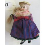 A bisque socket head doll's house doll, with blue glass fixed eyes, blond wig, 5 piece bisque