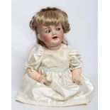 A Kammer & Reinhardt bisque socket head flirty character doll, with blue glass flirty eyes, sleeping