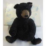 A boxed Steiff Winnipeg bear, in black and seated, 46cm (Est. plus 21% premium inc. VAT)