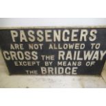 A "Passenger Must Cross The Railway By the Bridge" cast iron sign, minor rusting, F (Est. plus 21%