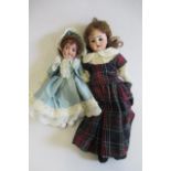 Two small bisque head dolls, comprising an 8 1/2" Armand Marseille socket head with brown glass