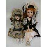 Two Armand Marseille bisque socket head dolls, 390 mold, with brown glass sleeping eyes, open
