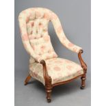 A VICTORIAN WALNUT FRAMED SALON CHAIR, upholstered in a pale cream and salmon weave, arched