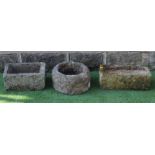 A SMALL SANDSTONE TROUGH, oblong, 21" X 10" X 6", together with another, 13 1/2" x 14 1/2" x 5 1/2",