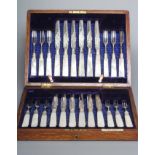 A SET OF TWELVE EDWARDIAN FRUIT KNIVES AND FORKS, maker R & W Sorley, Sheffield 1908, with foliate