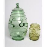 A GERMAN GREEN DAUMENGLAS OR THUMB GLASS AND COVER, c.1800, of barrel form, the central section with