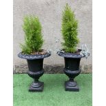 A PAIR OF CAST IRON URNS of half fluted campana form with ovolu rims, waisted socle and square base,
