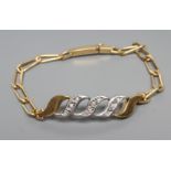 A BRACELET, the three central white metal S shaped panels each pave set with small round brilliant