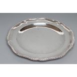 A LATE GEORGE III PLATE, maker Parker & Wakelin, London 1793, of shaped circular form with cast