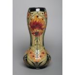 A MOORCROFT POTTERY VASE, 2006, of tall baluster form with bulbous neck, tubelined and painted in