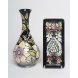 A MOORCROFT POTTERY VASE, 2002, of baluster form, tubelined and painted in colours with the Clematis