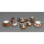 A ROYAL CROWN DERBY CHINA THREE PIECE IMARI PATTERN MINIATURE TEA SERVICE, 1919, with prow teapot,