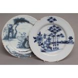 AN ENGLISH DELFT PLATE, London c.1760, of plain circular form painted in blue with a lady perched on
