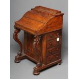 A VICTORIAN BURR WALNUT DAVENPORT, the rise and fall stationery compartment with drawers and