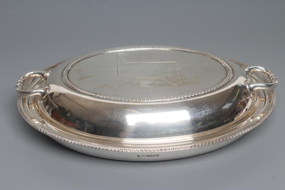AN OVAL ENTREE DISH AND COVER, maker Walker & Hall, Sheffield 1931, with cast and applied