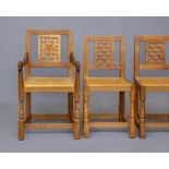 A ROBERT THOMPSON SET OF SIX OAK DINING CHAIRS including two elbow chairs, with pierced lattice